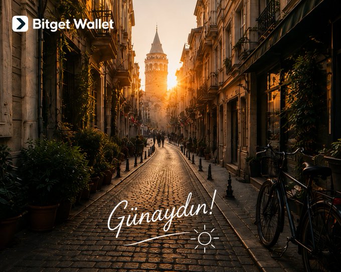 A promotional image for Bitget Wallet featuring a sunlit cobblestone street with the Galata Tower in the background and the greeting 'Günaydın!' written in script at the bottom.