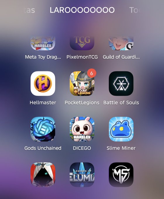 A mobile home screen displaying various gaming/Web3 app icons including Meta Toy Dragons, PixelmonTCG, Guild of Guardians, Hellmaster, PocketLegions, Battle of Souls, Gods Unchained, DICEGO, and Slime Miner.