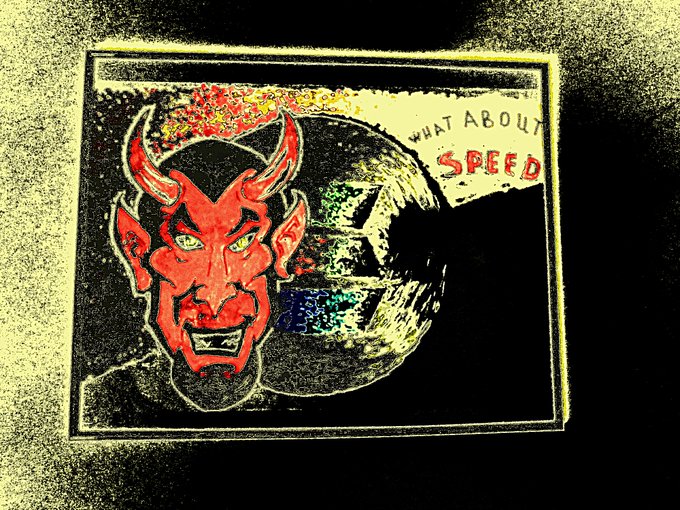 A stylized poster featuring a red horned devil face with the text 'WHAT ABOUT SPEED' alongside a tire graphic, rendered with a vintage halftone print effect.