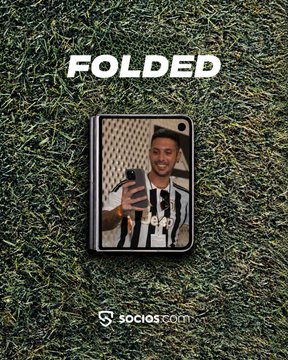 A promotional graphic on a grass background showing a framed photo of a person with the text 'FOLDED' and 'SOCIOS.COM' below it.