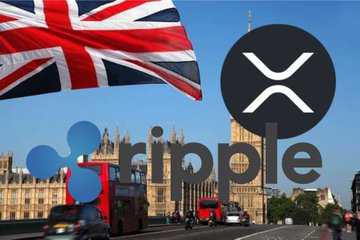 A Union Jack flag waves over the London skyline, including the Palace of Westminster and a red double-decker bus, with the Ripple (XRP) logo prominently overlaid, visually linking the cryptocurrency to the Bank of England.