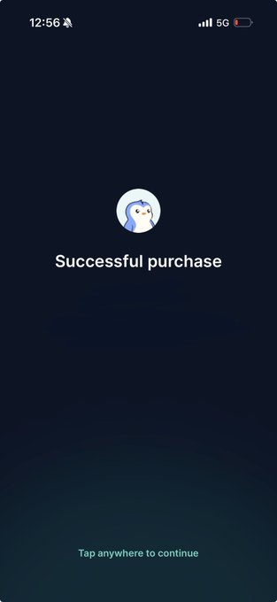 A dark blue mobile app screen displaying an owl logo and the text 'Successful purchase' with 'Tap anywhere to continue' at the bottom.