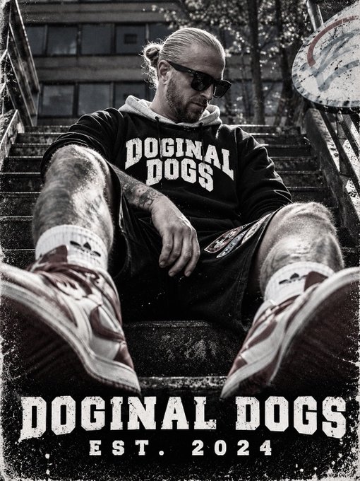 A black and white promotional poster for 'DOGINAL DOGS EST. 2024' showing a man sitting on stairs wearing sunglasses, a hoodie with the brand name, and sneakers.