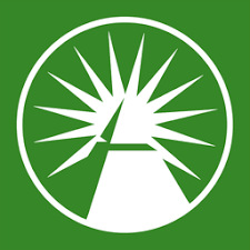 A green square logo featuring a white circular design with a stylized tree or pyramid shape surrounded by radiating spikes or rays.