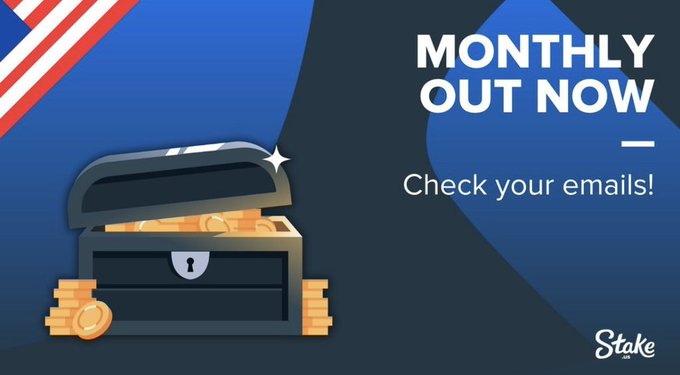 A promotional graphic for Stake features an open treasure chest overflowing with gold coins alongside the bold text "MONTHLY OUT NOW — Check your emails!" and the Stake logo, confirming that the August Monthly bonus has officially been released to US players.