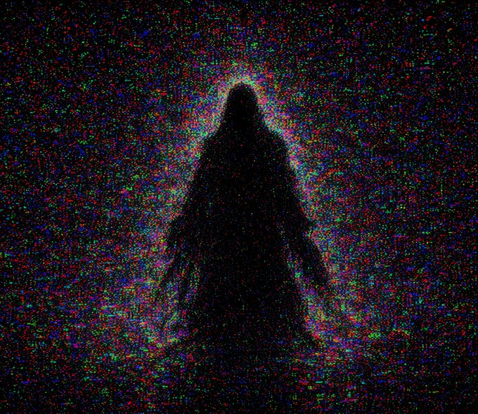 A dark silhouette of a hooded figure surrounded by colorful digital noise or static against a black background.