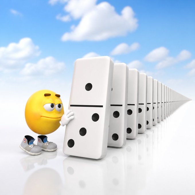 A 3D rendered yellow smiley face emoji character in sneakers pushing against a long line of dominoes in a bright sky setting.