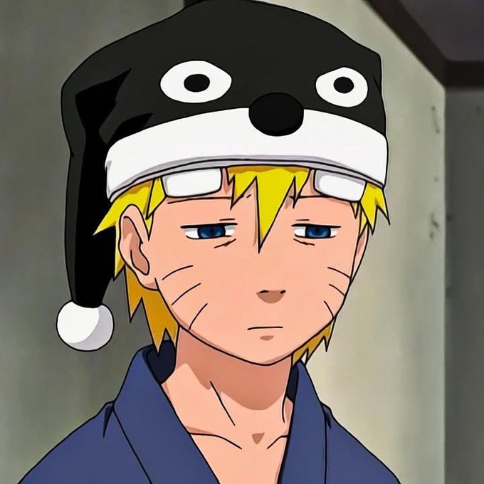 A close-up anime portrait of Naruto Uzumaki wearing a black cat-themed sleeping cap, with his characteristic whisker marks and blue eyes visible.