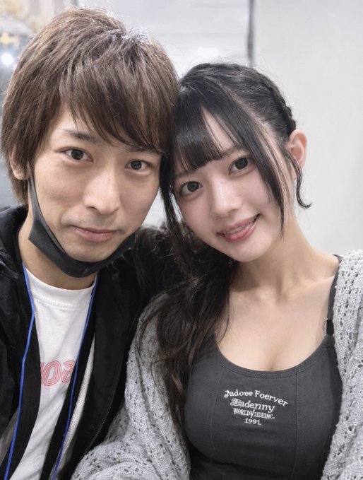 A young couple poses closely together for a selfie; the woman's gray tank top reads "Jadese Foerver Bademry Purivtdeine 1991." The image matches the post's description of a leaked candid two-shot of "Sokun" with his cute partner, jokingly suggesting he's so smitten he has no interest in seeing his friend "Masatsugu" anymore.