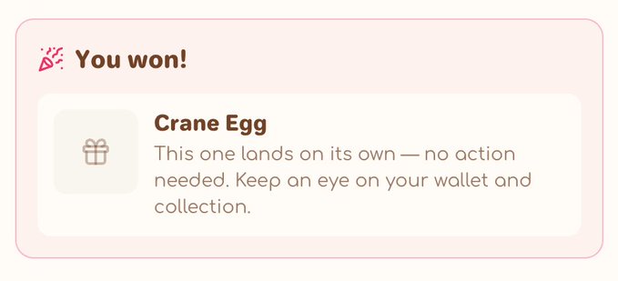 A pink and white notification card with a party popper icon reads 'You won!' and announces a 'Crane Egg' prize, noting that it will land automatically with no action required.