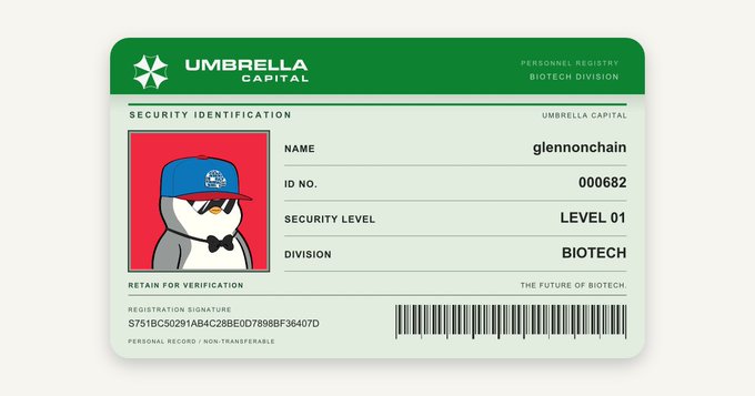 A green 'UMBRELLA CAPITAL' security ID card for the Biotech Division, featuring a penguin avatar wearing a blue cap and bow tie, with the name 'glennonchain', ID No. 000682, and Security Level 01.