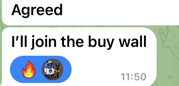A screenshot of a WhatsApp chat showing a message that reads "Agreed" followed by "I'll join the buy wall," sent at 11:50, accompanied by a fire emoji and a cool sunglasses-wearing dog meme sticker, illustrating the poster's call for followers to join a buying support level for the ticker $HMM.