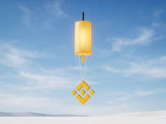 A golden lantern-shaped 3D object with the Binance (BNB) logo suspended beneath it, floating against a blue sky with wispy clouds.
