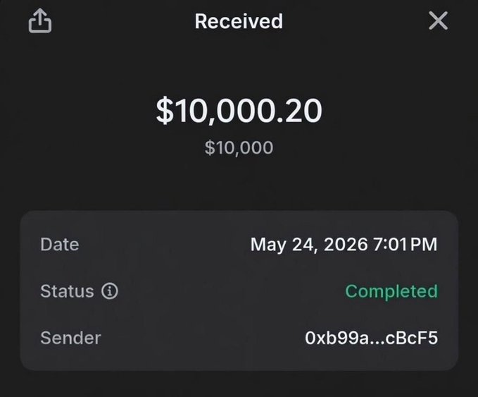 A dark-themed app screen shows a received payment of '$10,000.20' with the status 'Completed', dated 'May 24, 2026 7:01PM', from sender '0xb99a...cBcF5'.