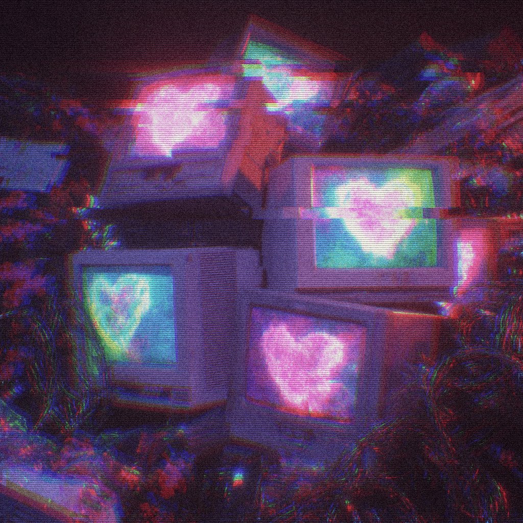 The image features a collection of old computer monitors, each with a heart shape drawn on them. The monitors are stacked together, creating an interesting visual effect that draws attention to their unique design. The background appears to be dark or black, which contrasts with the colorful monitors and makes them stand out even more. The post includes text that reads "and still in the end, perhaps the computers still hum" and "@LILIDYZ for the wonderful gift of @objktcom Love it! objktcom/tokens/KT1VNQR". This suggests a connection between the monitors and the person who sent them or someone else who received them.