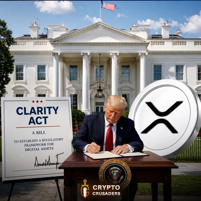 The image features a man sitting at a desk, signing a document with a pen. The document appears to be related to cryptocurrency or digital assets, as there are two coins visible in the scene - one placed near the man's head and another on his lapel. The text " TRUMP IS GOING TO SIGN THE CLARITY BILL NOW!! HANG TIGHT $XRP AND CRYPTO FAM!" suggests that the man is involved in a political context, possibly related to cryptocurrency or digital asset regulations.

The image also includes an American flag and a building with columns, which could be a government building or an office of some sort. The presence of these elements reinforces the idea that this scene takes place within a political setting.