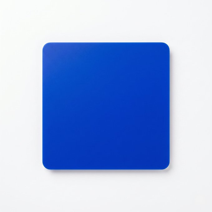 The image features a square, blue mouse pad placed against a white background. The mouse pad has a unique design that stands out due to its vibrant color and interesting shape. It's not just another ordinary mouse pad; it appears to be an intentional choice made by someone who wanted to create a visually appealing and memorable object.