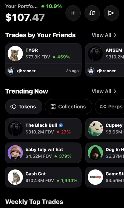 A mobile app screen showing a portfolio balance of $107.47 (up 10.9%), featuring 'Trades by Your Friends' with TYGR and ANSEM tokens, and a 'Trending Now' section listing tokens like The Black Bull, Cupsey, and Cash Cat.