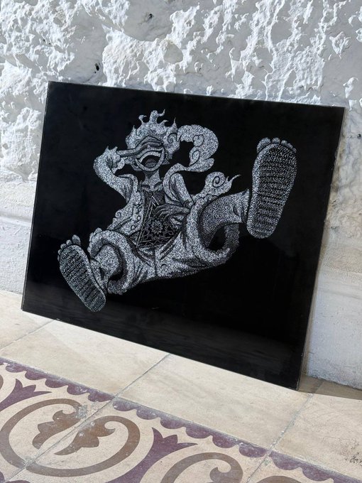 The image features a black and white drawing of a person with their feet raised up, sitting on one leg. The drawing is placed next to a tiled floor, possibly an entrance or a hallway. The caption below the image reads "Zelij Origins Giveaway" and provides details about how to enter the giveaway.