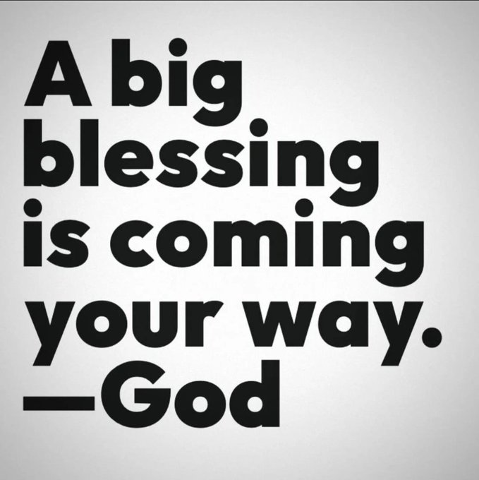 A black and white graphic displays the bold quote: "A big blessing is coming your way. —God." The accompanying post shares a "Good morning" greeting to the #XRPFamily, pairing the encouraging religious message with a hopeful start to the day for the crypto community.