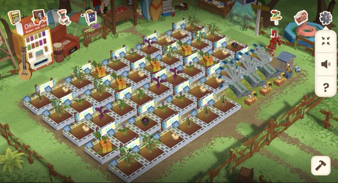 A densely packed farm layout in the game featuring a large grid of identical crop plots with growing plants, surrounded by windmills and farm structures.