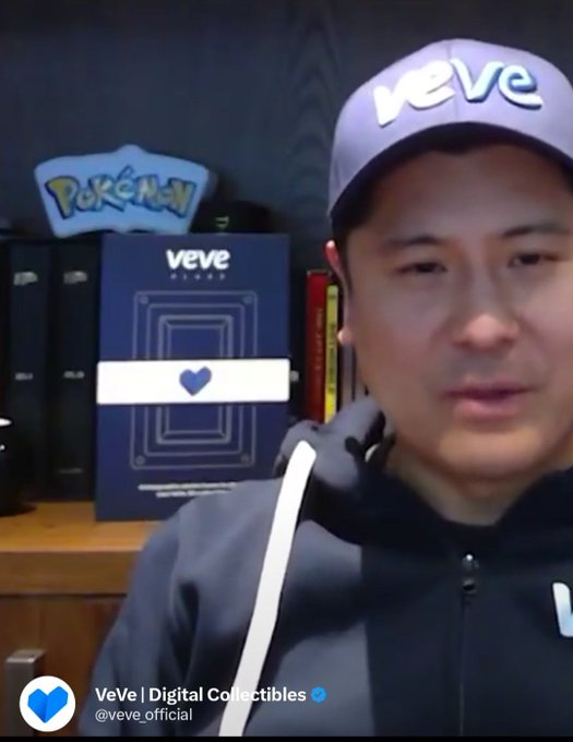 A man wearing a "VeVe" cap sits in front of a Pokémon sign and VeVe-branded display, with the social media handle "VeVe | Digital Collectibles @veve_official" shown below, aligning with the post's excitement about Pokémon collectibles on the VeVe platform.
