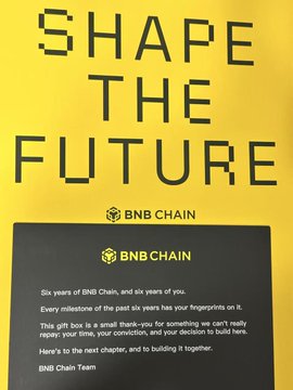 A yellow BNB Chain promotional image with the text 'SHAPE THE FUTURE' and a message commemorating six years of BNB Chain.