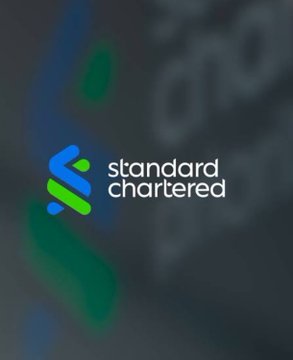 The Standard Chartered logo is displayed on screen as the bank makes headlines for becoming the first global bank to offer institutional Bitcoin and Ethereum spot trading in the UAE.