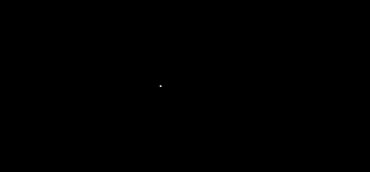 The image features a black and white square with a small dot in the center, which appears to be a star or a planet. The background of the image is gray, providing contrast to the dot. The caption below the image reads "Hey Ritual fam I’m continuing my journey through the Ritual Testnet dApps, and I just found another gem Shoutout to @cryptowoodd for building Ritual Atlas What is Ritual Atlas? It's a galaxy-style explorer for the Ritual Testnet ecosystem".