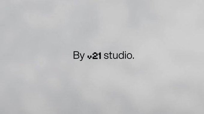 A minimalist gray and white textured background displaying the text 'By v21 studio.' with a small leaf logo.