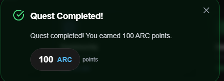 A screenshot of a computer screen, showing a message with 100 ARC points displayed. The text on the screen says "Quest completed! You earned 100 arc points".