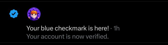 The image features a dark blue checkmark placed above the phrase "Your Blue Checkmark Is Here!" A purple cartoon character with orange hair is positioned below the checkmark, with text that reads "Your Account is now Verified". The caption of the photo is an explanation for the checkmark, stating how long it has been present in the account after 100 hours.