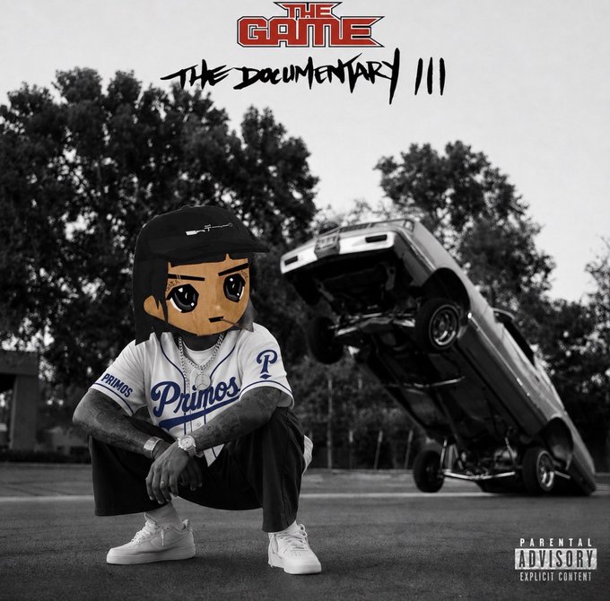 A black-and-white album/movie cover titled 'THE GAME THE DOCUMENTARY III' featuring a cartoon figure in a Primos jersey squatting near an overturned car, with Parental Advisory Explicit Content label.