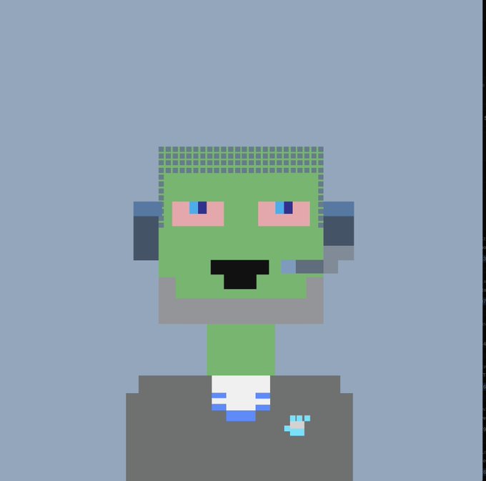 A simple pixel art character with a green face, pink eyes, a headset, and a small microphone appears on a gray background, sitting behind what looks like a gray laptop or podium.