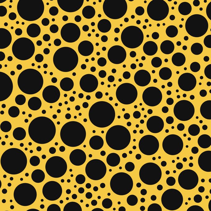 A graphic design pattern featuring black polka dots of varying sizes scattered across a solid yellow background.