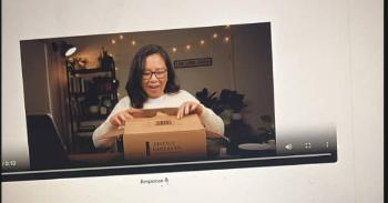 A screenshot of a video player shows a woman with glasses unboxing a package on camera, with video controls visible at the bottom.