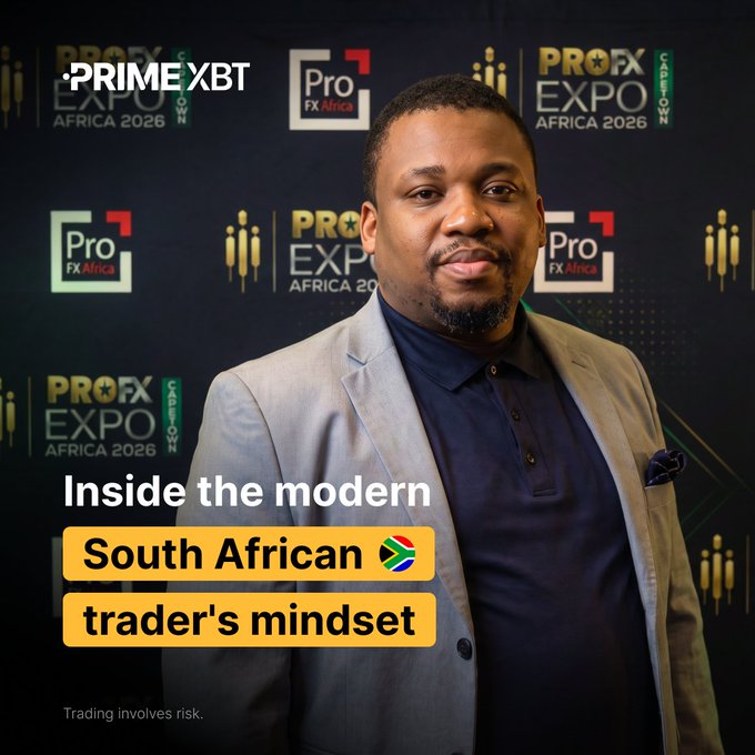 A promotional image for PrimeXBT at the ProFX Expo Africa 2026 featuring a man in a grey suit against a branded backdrop, with text reading 'Inside the modern South African trader's mindset' and a disclaimer 'Trading involves risk.'