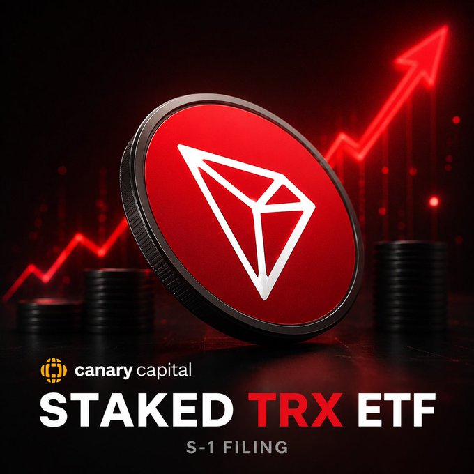 A promotional graphic for Canary Capital's Staked TRX ETF features a large red Tron (TRX) coin centered against a dark background with a rising red price chart, accompanied by the text "canary capital," "STAKED TRX ETF," and "S-1 FILING." The image visually emphasizes the bullish institutional momentum referenced in the post, illustrating how the proposed ETF combines staking rewards with traditional ETF structure to position Tron (TRX) for broader investment appeal.