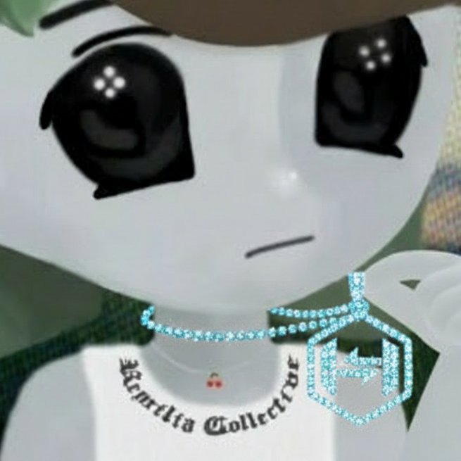 A 3D animated character with large glossy eyes wearing a white shirt with 'Chandlia Collective' text and a light blue diamond-encrusted pendant necklace, appearing to be from a Roblox-style game.