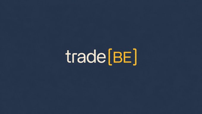 The image shows a logo for a company named "Trade". The logo consists of the words "Trade" written in yellow letters, positioned above each other with a gray background. Below the logo, there's some text that reads "@tradexyz as deployer". This suggests that the company is now live and available for deployment on social media platforms.