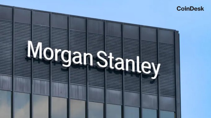 The exterior of a Morgan Stanley office building with the corporate name displayed in large white letters on a dark glass facade, with a CoinDesk watermark in the upper right corner.