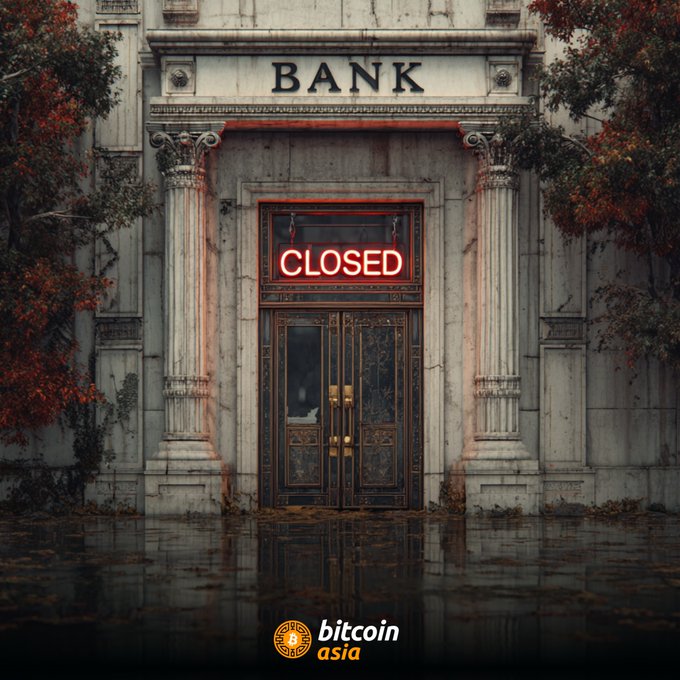 The image shows a bank building with its doors closed, indicating that the bank is currently closed for the weekend. The text "Your bank is closed this weekend, prohibiting you access to the money you worked hard for" suggests that customers may face difficulties accessing their funds during this time. This message also mentions Bitcoin, which could be related to the bank's operations or services.