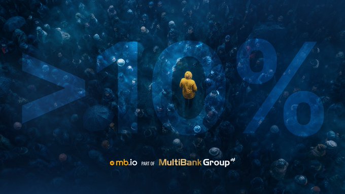 A figure in a yellow hoodie stands alone among a vast crowd, overlaid with a faint "10%" watermark, with the text "omb.io Part of MultiBank Group" at the bottom. The image visually reinforces the post's message that crypto adoption is still under 10% of the global population, highlighting the massive untapped potential as the majority of the world has yet to participate.