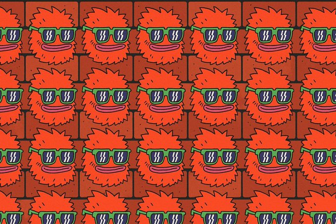 A seamless repeating pattern of cartoon-style red furry creatures wearing green sunglasses with white lightning bolts, displayed against a backdrop of red triangles. The image visually echoes the "Red triangle world order" theme through its dominant red color palette and the triangular arrangement of the repeating characters.