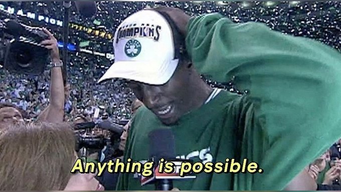 A screenshot of Paul Pierce wearing a Boston Celtics 'Champions' cap and green warm-up gear on a post-game interview set, captioned 'Anything is possible.'