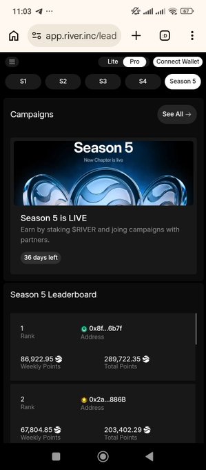 iphone screen displays a black and white photo of a blue and silver water droplet, with the text "Season 5 Live" and "LIVE" below it.