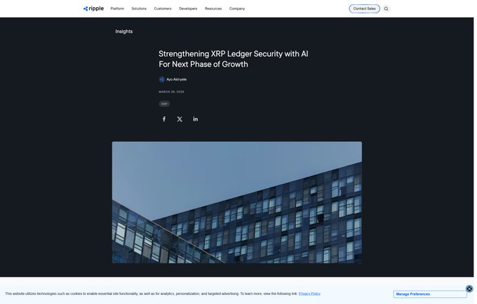 Ripple's blog post "Strengthening XRP Ledger Security with AI For Next Phase of Growth," authored by Ayo Akiwowo and dated March 26, 2026, is shown with an image of a modern glass office building, illustrating the company's adoption of AI-driven red team testing to enhance XRPL security through automated vulnerability discovery.