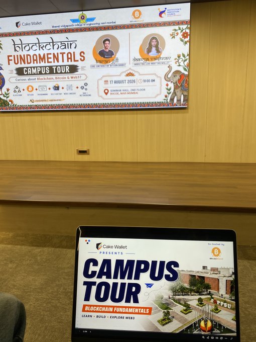 A presentation screen and laptop display for the 'Blockchain Fundamentals Campus Tour' by Cake Wallet, with the slide dated '17 August 2026' and featuring two speakers.