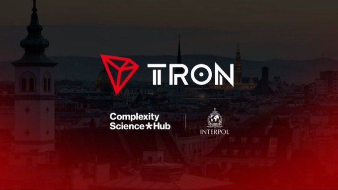 A dark title card shows the red TRON logo and the text “TRON,” “Complexity Science★Hub,” and “INTERPOL” over a city skyline.