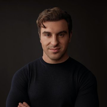 A portrait of Airbnb CEO Brian Chesky against a dark background, featured in a news post reporting that hackers compromised his account to post a now-deleted thread promoting tokenized real-world assets (RWAs).